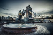 Girl with A Dolphin Fountain by Tower Bridge